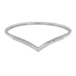 A diamond chevron bangle.Estimated total diamond weight 0.50ct.