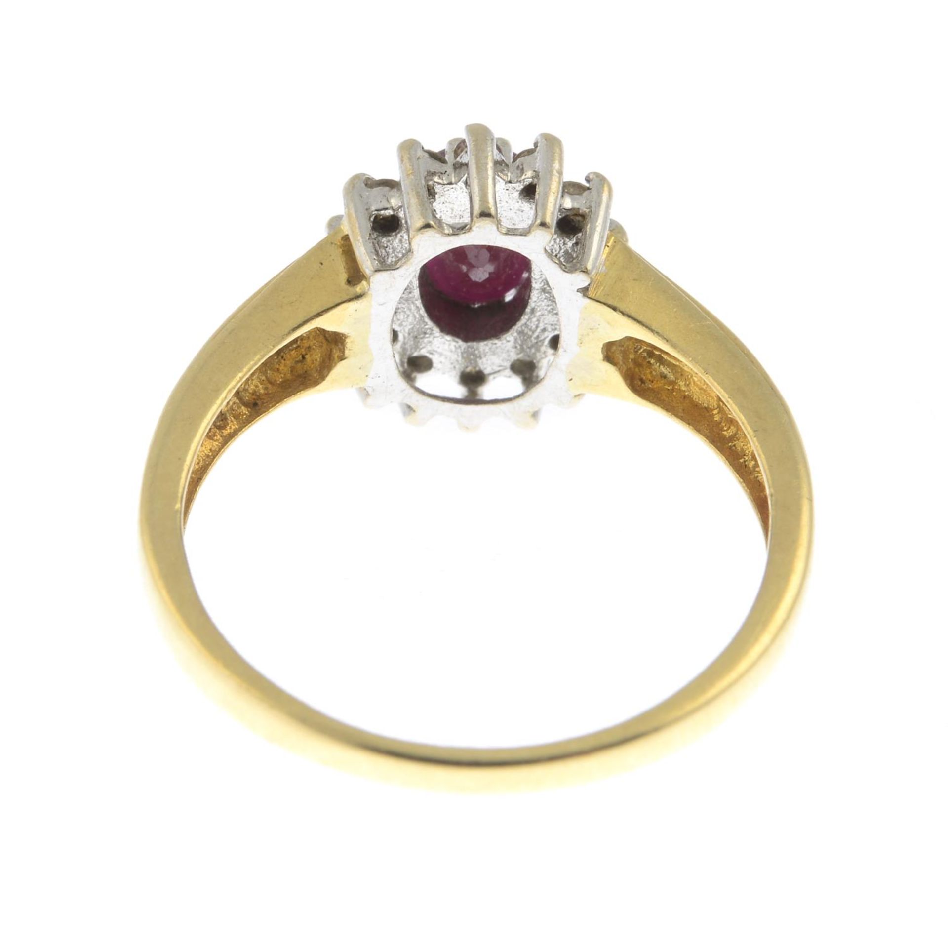 An 18ct gold ruby and diamond cluster ring.Total diamond weight 0.33ct, stamped to band. - Bild 2 aus 3