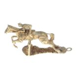 A 9ct gold racing horse and jockey charm.Hallmarks for London, partially indistinct.