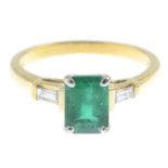 An emerald and diamond three-stone ring.Emerald weight 1.22cts.