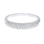 An 18ct gold brilliant-cut diamond half eternity ring.Estimated total diamond weight