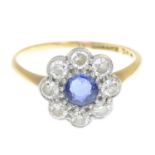 A sapphire and diamond cluster ring.Estimated total diamond weight 0.55ct.