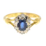 A sapphire and diamond cluster ring.Stamped 18CT.
