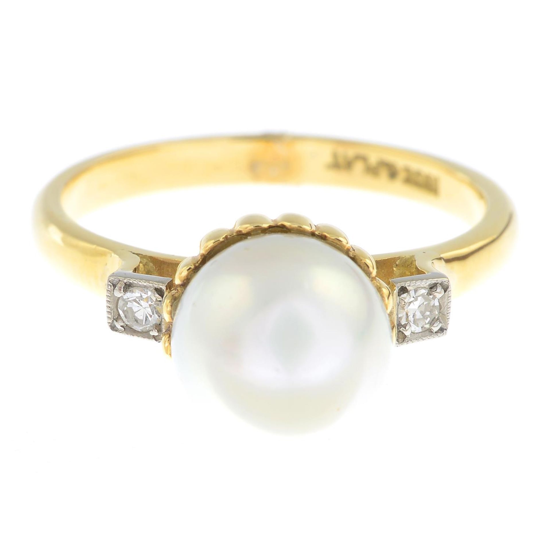 A cultured pearl and diamond three-stone ring.Cultured pearl measuring 8mms.
