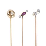 Three early 20th century gold diamond and ruby stickpins.