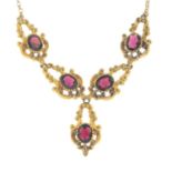 A 9ct gold garnet necklace.Hallmarks for 9ct gold.