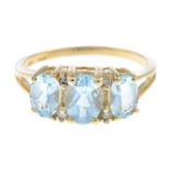 An aquamarine and diamond dress ring.Stamped 585.Ring size N.