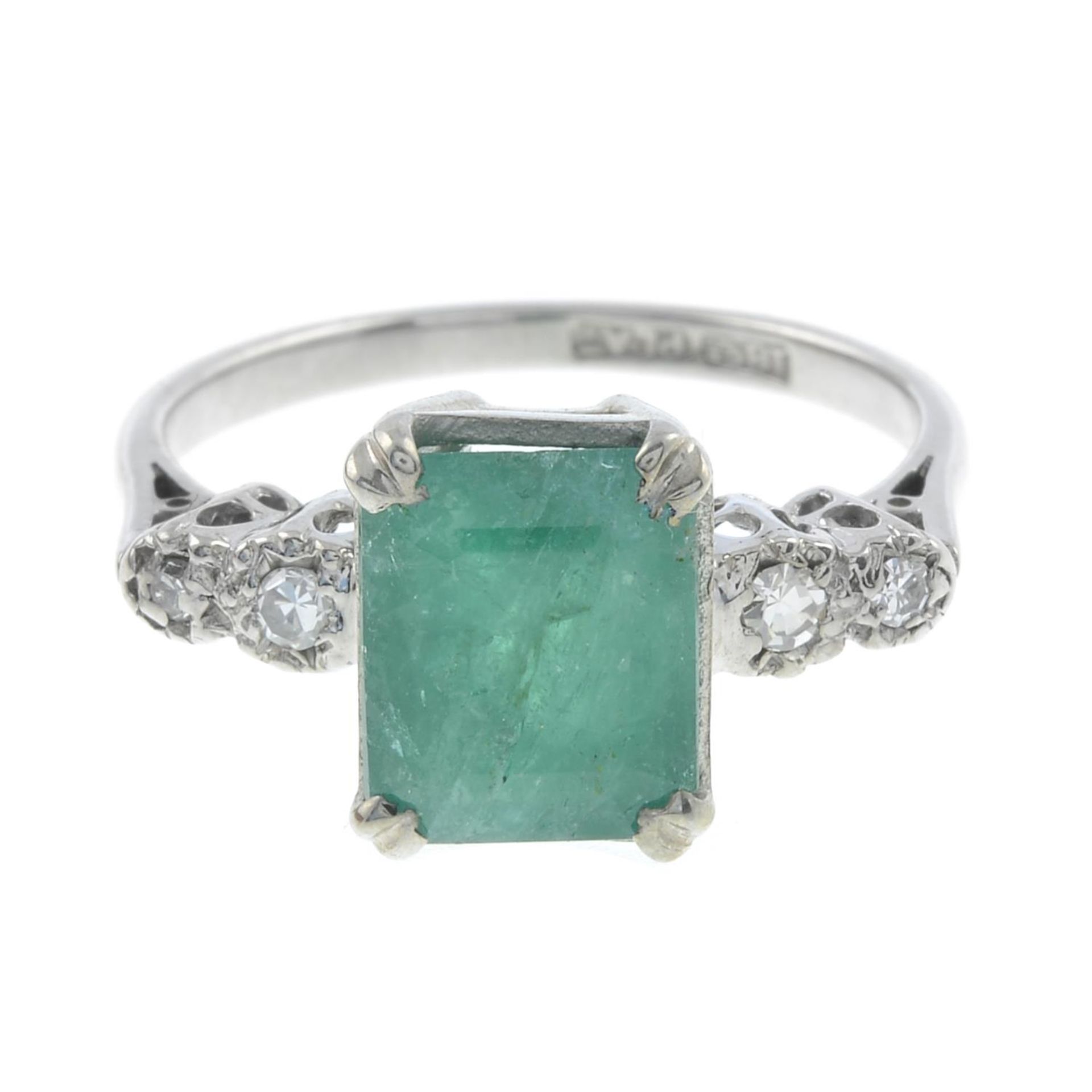An emerald and diamond dress ring.Emerald calculated weight 2.25cts,