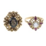 9ct gold garnet dress ring, depicting a floral motif, hallmarks for 9ct gold, ring size F, 4.4gms.