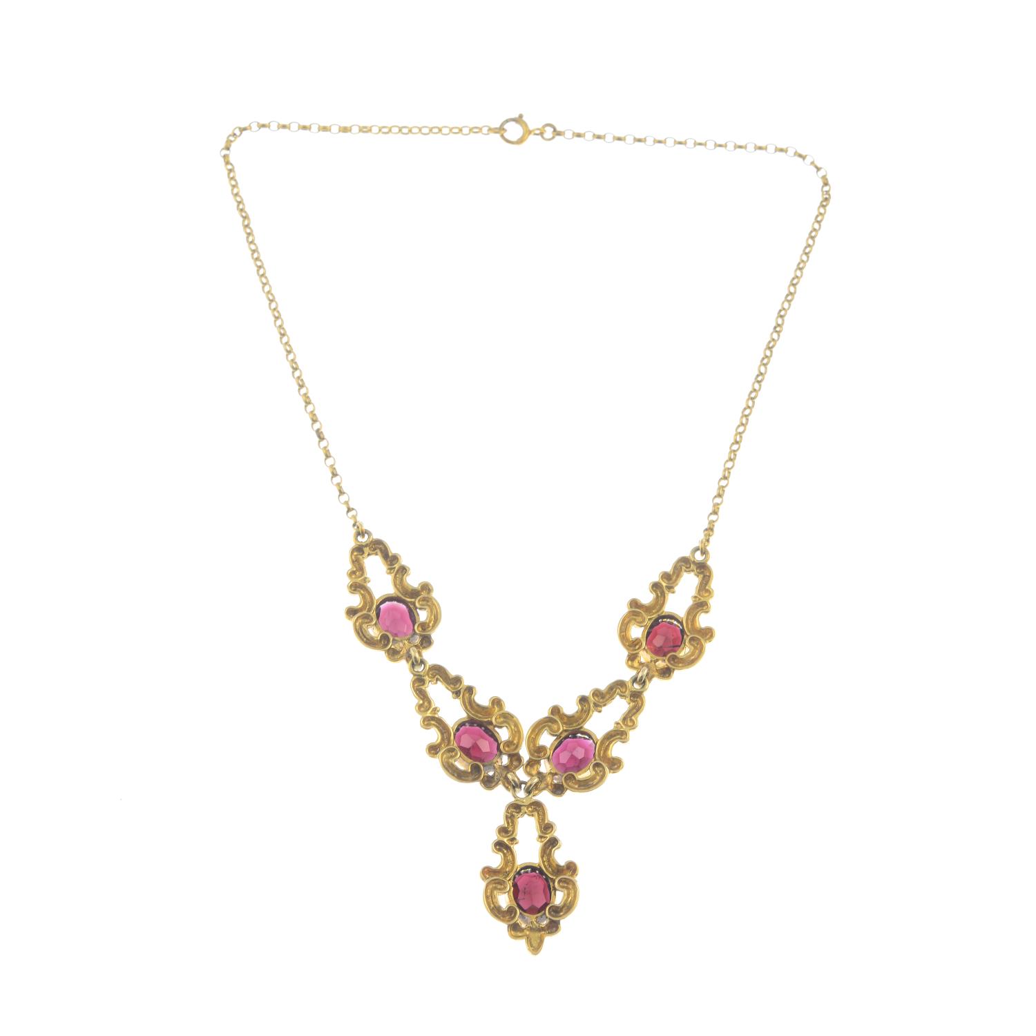 A 9ct gold garnet necklace.Hallmarks for 9ct gold. - Image 2 of 2