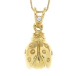 A brilliant-cut diamond ladybird pendant, with box-link chain.Italian marks.