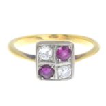 A circular-cut diamond and ruby ring.Estimated total diamond weight 0.15ct,
