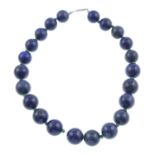 A lapis lazuli single-strand necklace, with emerald spacers.Length 42cms.