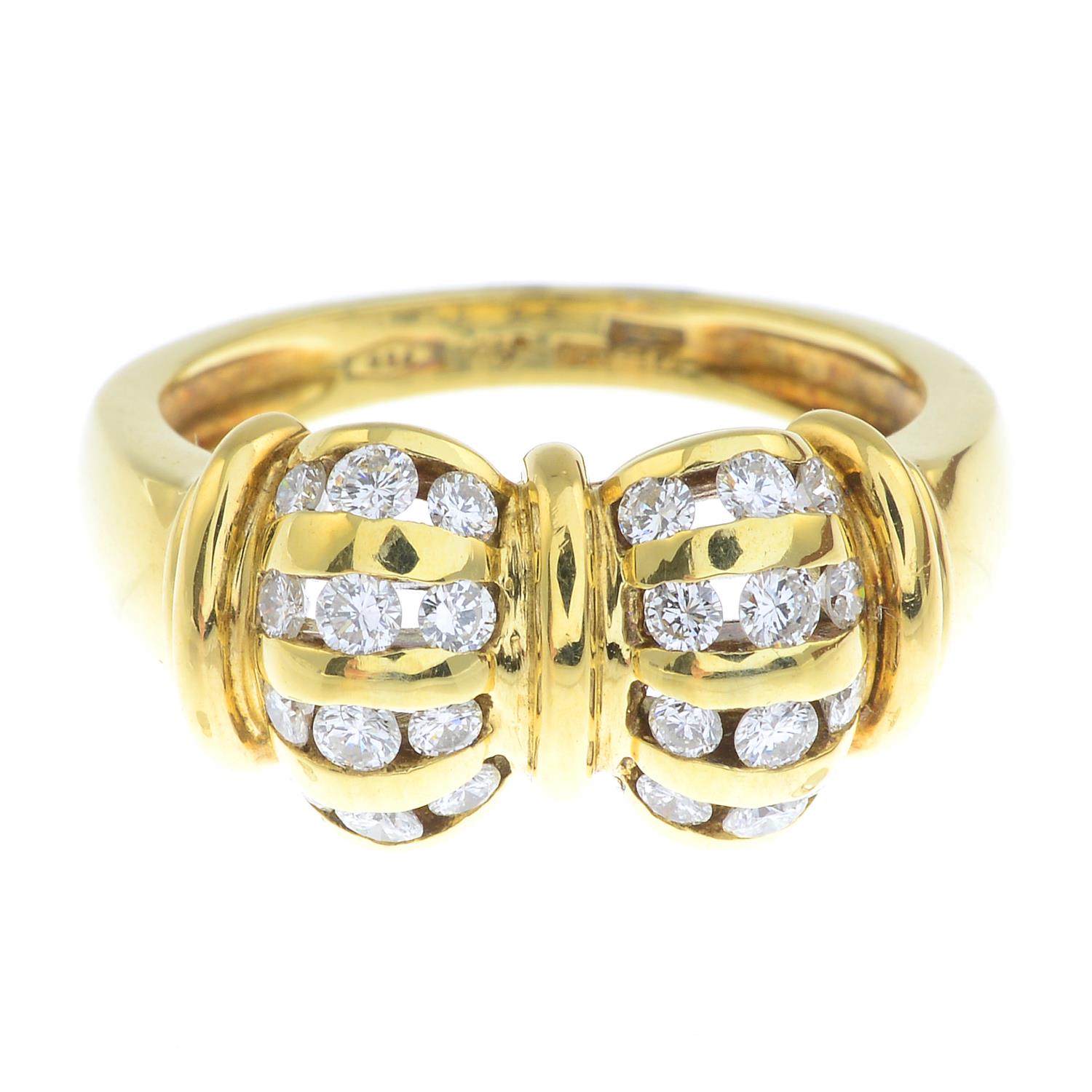 An 18ct gold diamond dress ring, depicting a bow.Estimated total diamond weight 0.55ct.