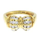 An 18ct gold diamond dress ring, depicting a bow.Estimated total diamond weight 0.55ct.