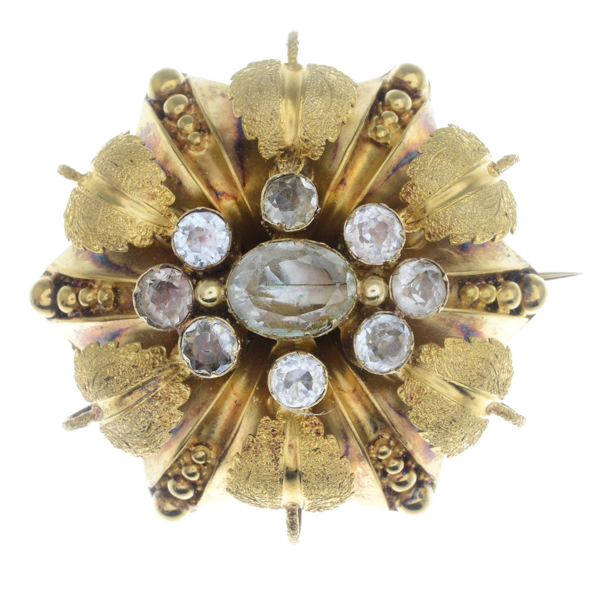 A late Victorian gold green beryl and colourless gem brooch, with glazed panel reverse.