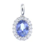 A sapphire and diamond pendant.Sapphire weight 0.93ct,