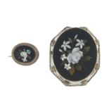 Two late 19th century pietra dura brooches.Lengths 1.9 and 4.4cms.