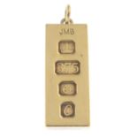 A 9ct gold ingot pendant.Hallmarks for 9ct gold.