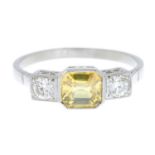 A yellow sapphire and brilliant-cut diamond three-stone ring.Sapphire weight 1.25cts.Estimated