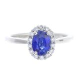 An 18ct gold sapphire and diamond cluster ring.Sapphire weight 1.08cts.