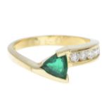 An emerald and brilliant-cut diamond dress ring.Estimated total diamond weight 0.25ct,