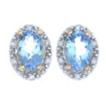 A pair of 18ct gold aquamarine and diamond cluster earrings.Hallmarks for 18ct gold.