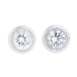 A pair of 18ct gold diamond stud earrings.Estimated total diamond weight 0.40ct,