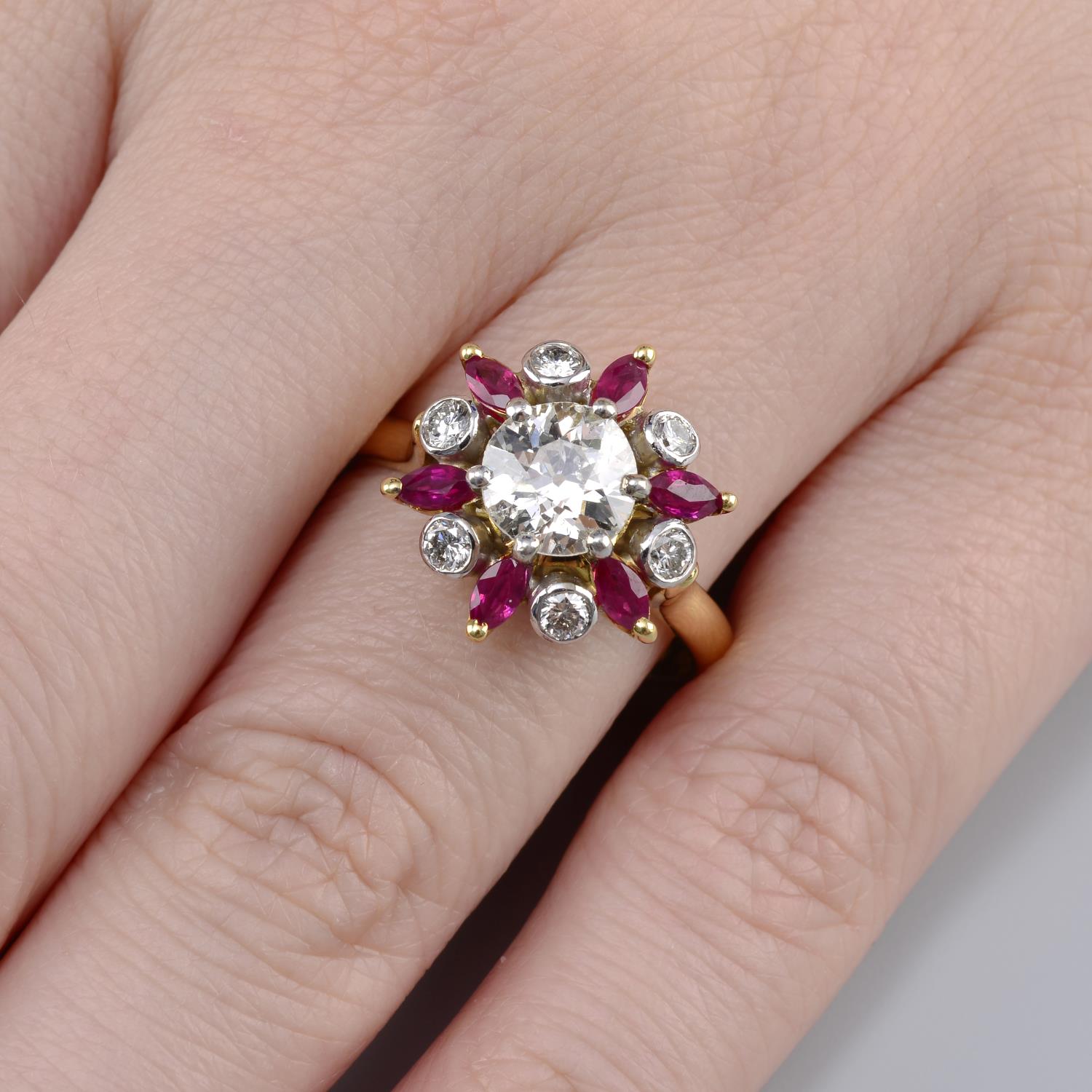 An 18ct gold old-cut diamond, ruby and brilliant-cut diamond floral cluster ring.