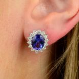 A pair of tanzanite and diamond cluster earrings.