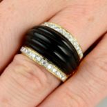 A carved onyx and diamond dress ring.