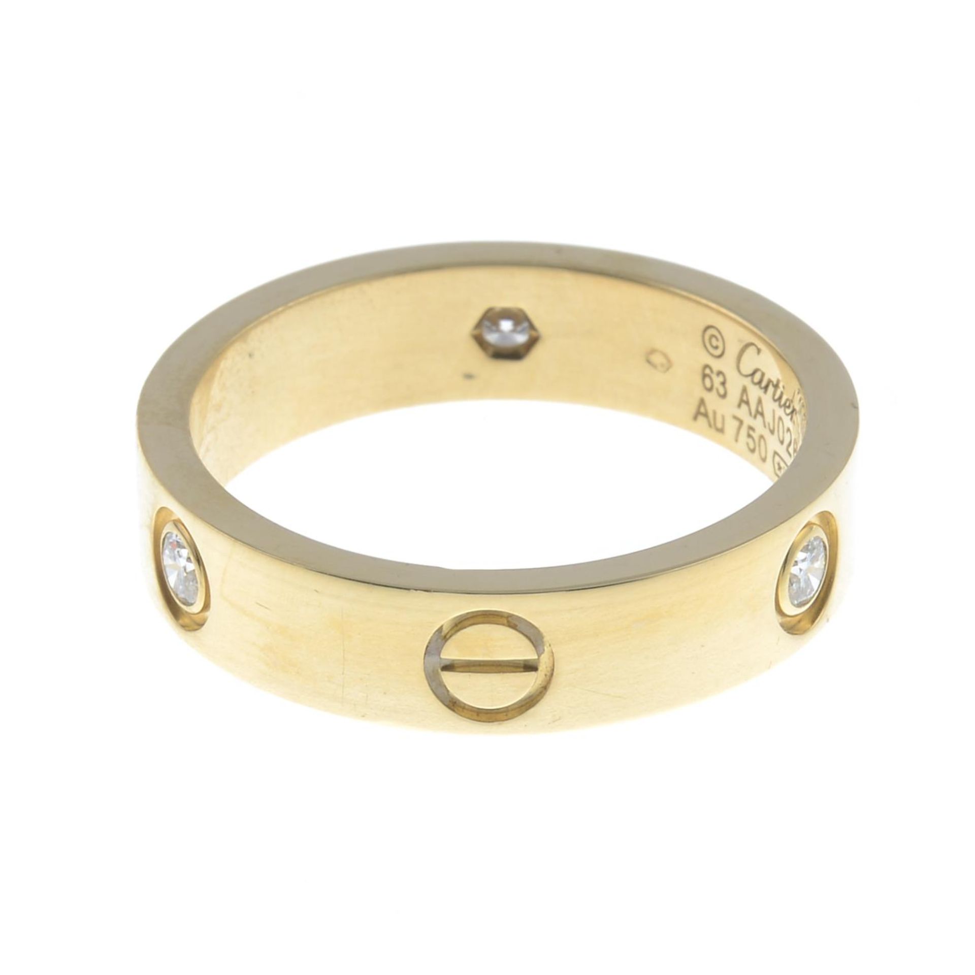 An 18ct gold diamond 'Love' ring, - Bild 5 aus 5