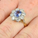 A sapphire and brilliant-cut diamond floral cluster ring.