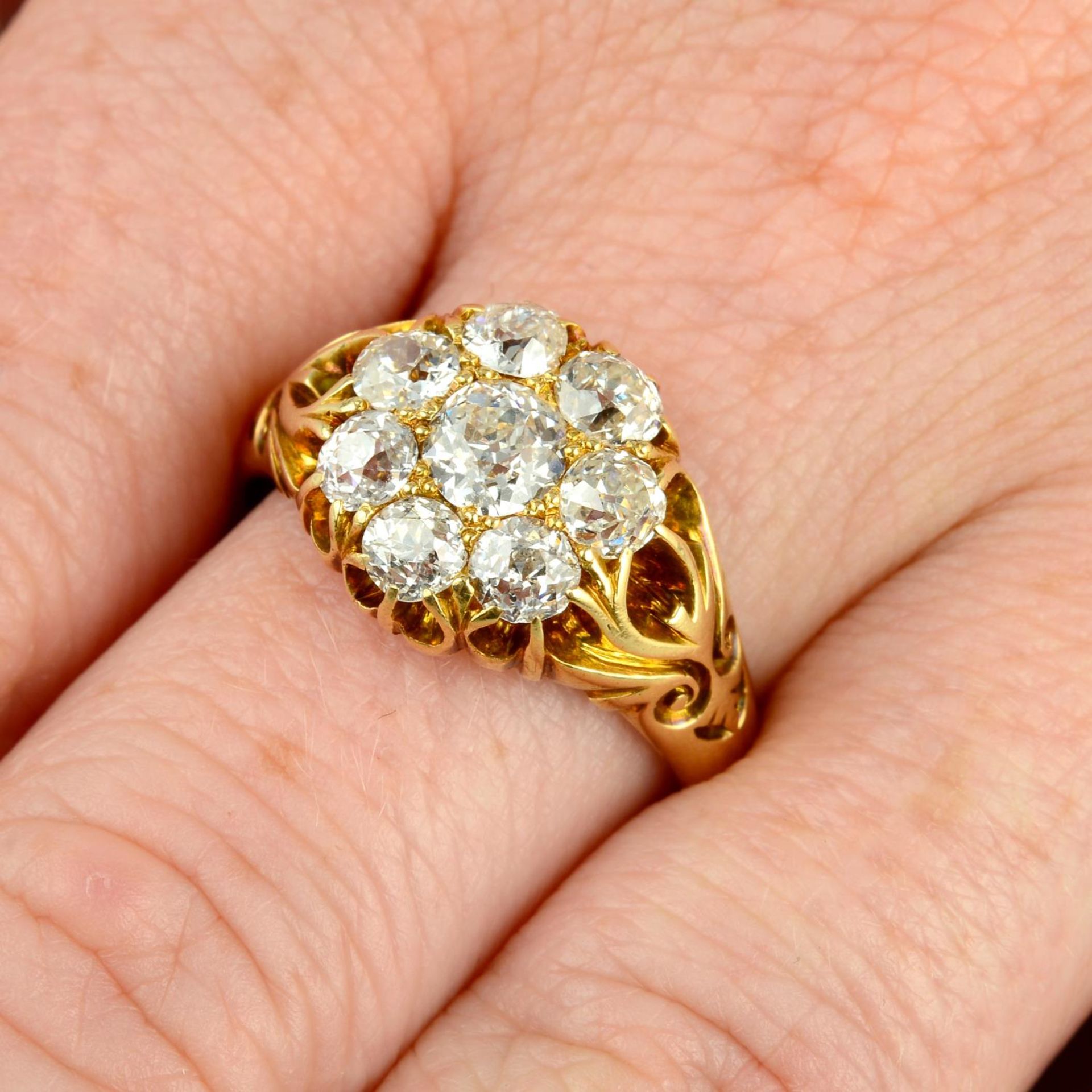 A late Victorian 18ct gold old-cut diamond cluster ring.