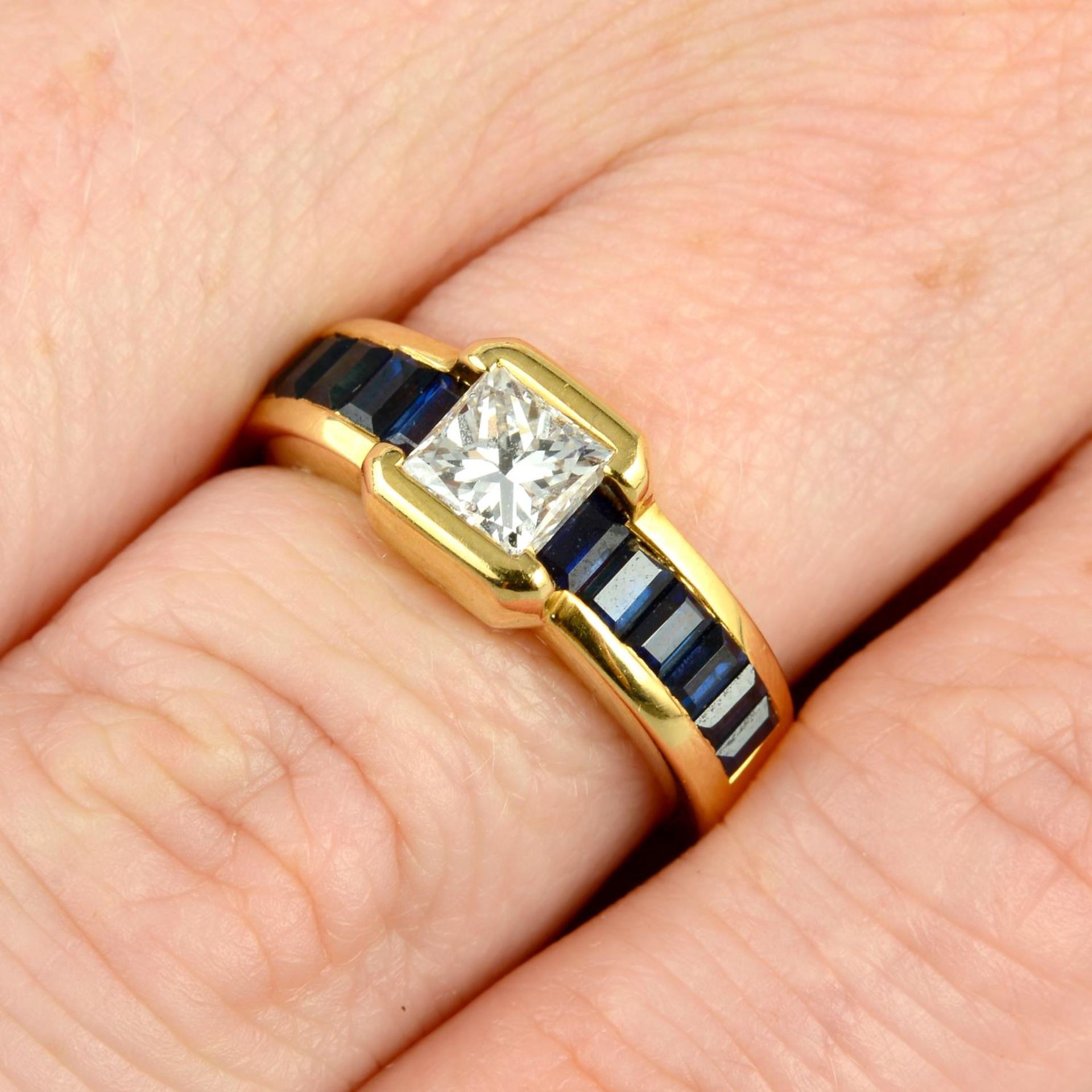 A square-shape diamond and calibre-cut sapphire dress ring,