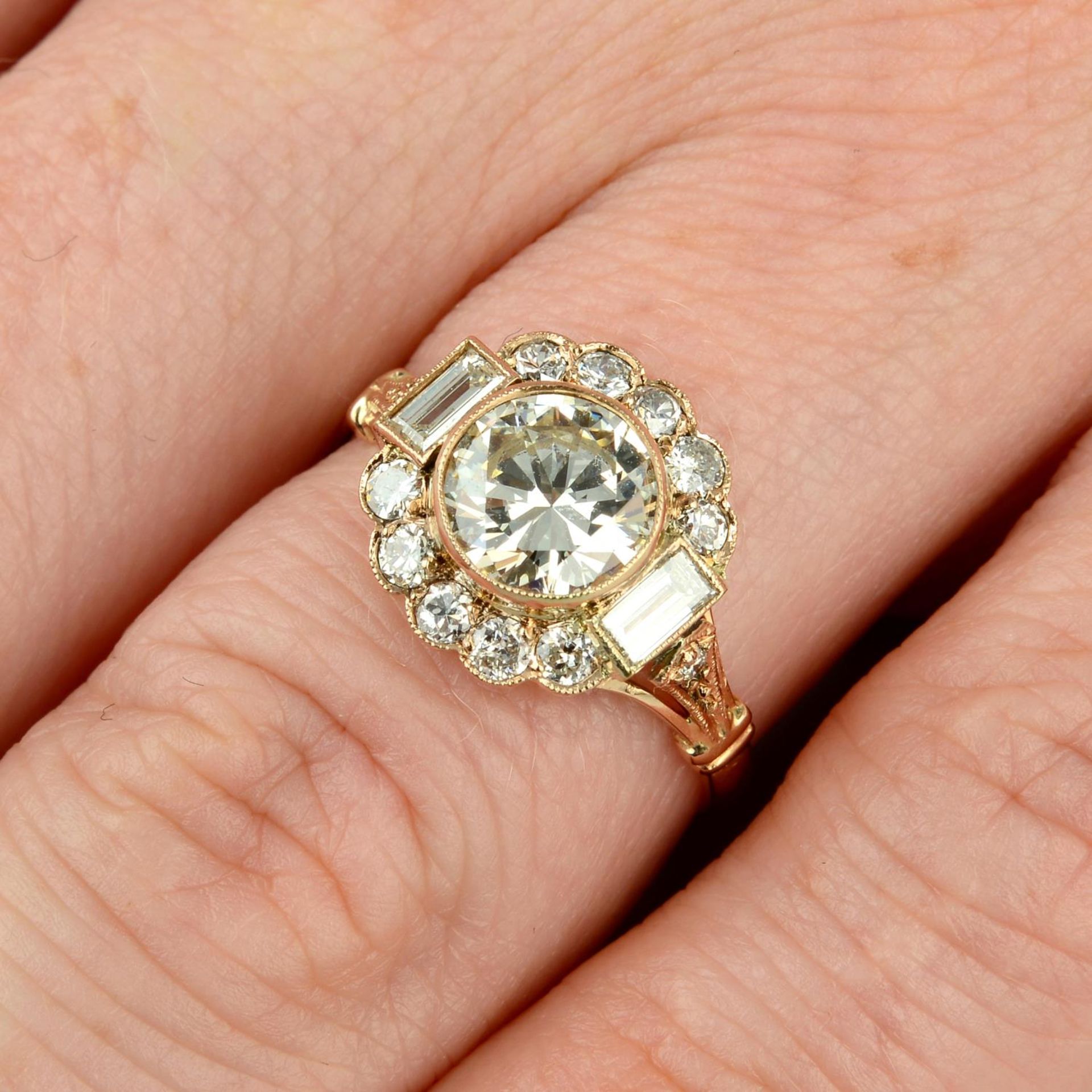 A brilliant-cut diamond cluster ring,
