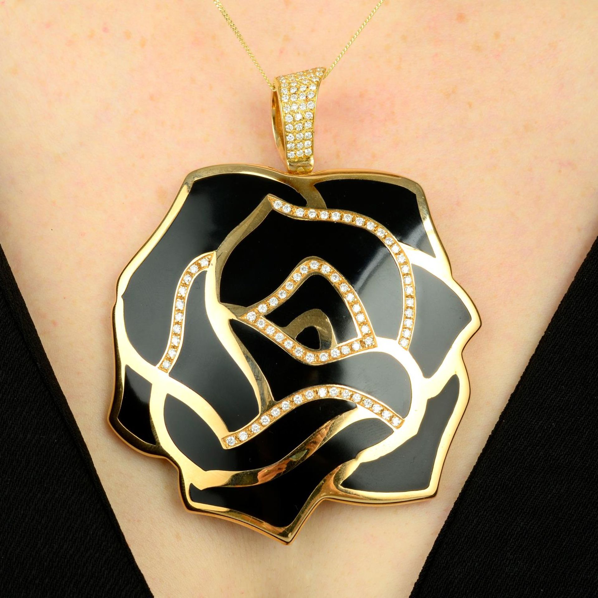 A large black enamel and pave-set diamond rose pendant,