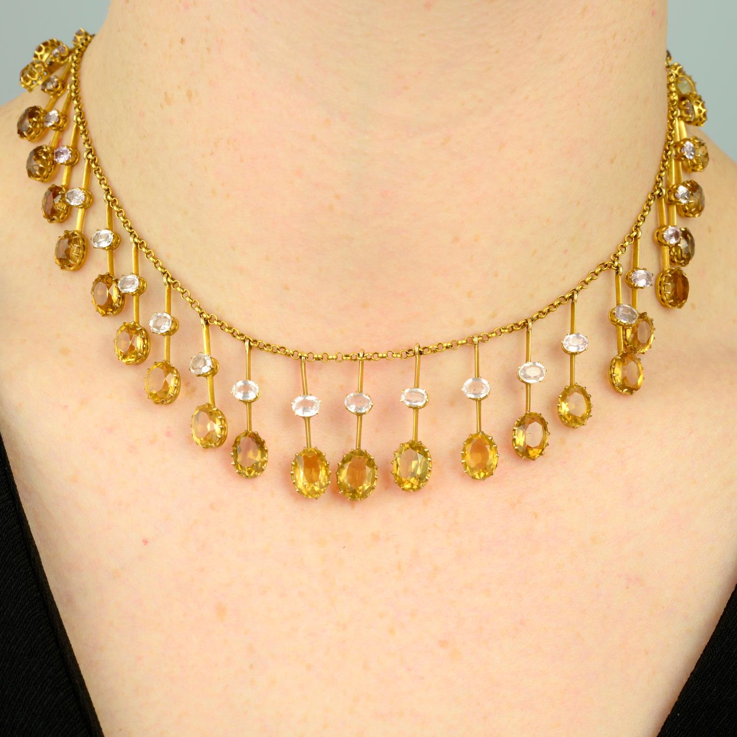 A late Victorian 15ct gold pink topaz and citrine fringe necklace.Length 37.5cms.