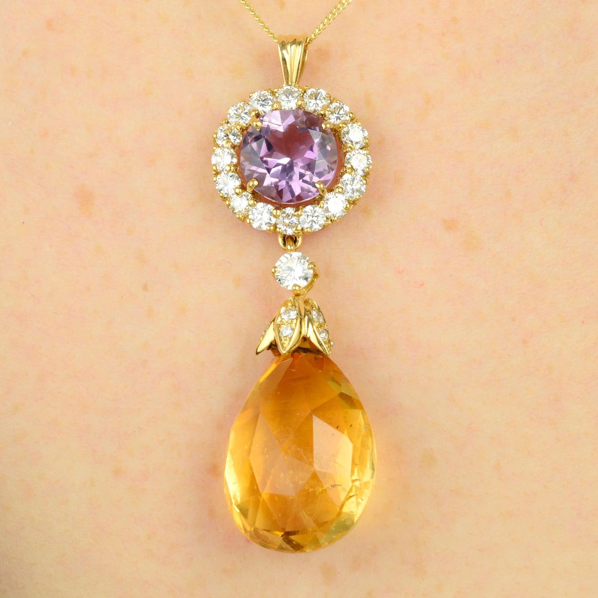 An amethyst, citrine and diamond drop pendant.Estimated total diamond weight 1.60cts,