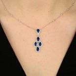 An 18ct gold sapphire and diamond cluster pendant, on diamond accent chain.