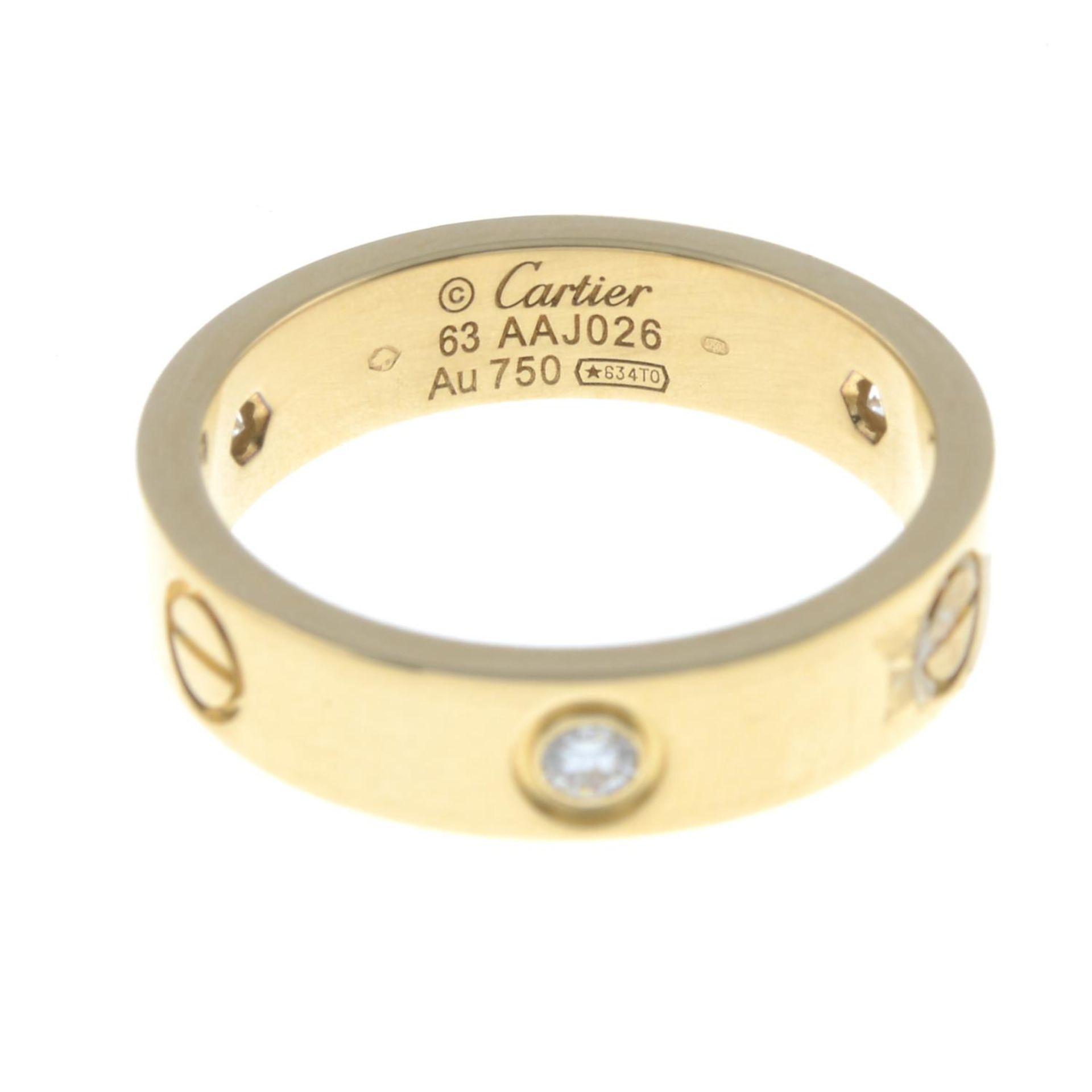 An 18ct gold diamond 'Love' ring, - Bild 4 aus 5