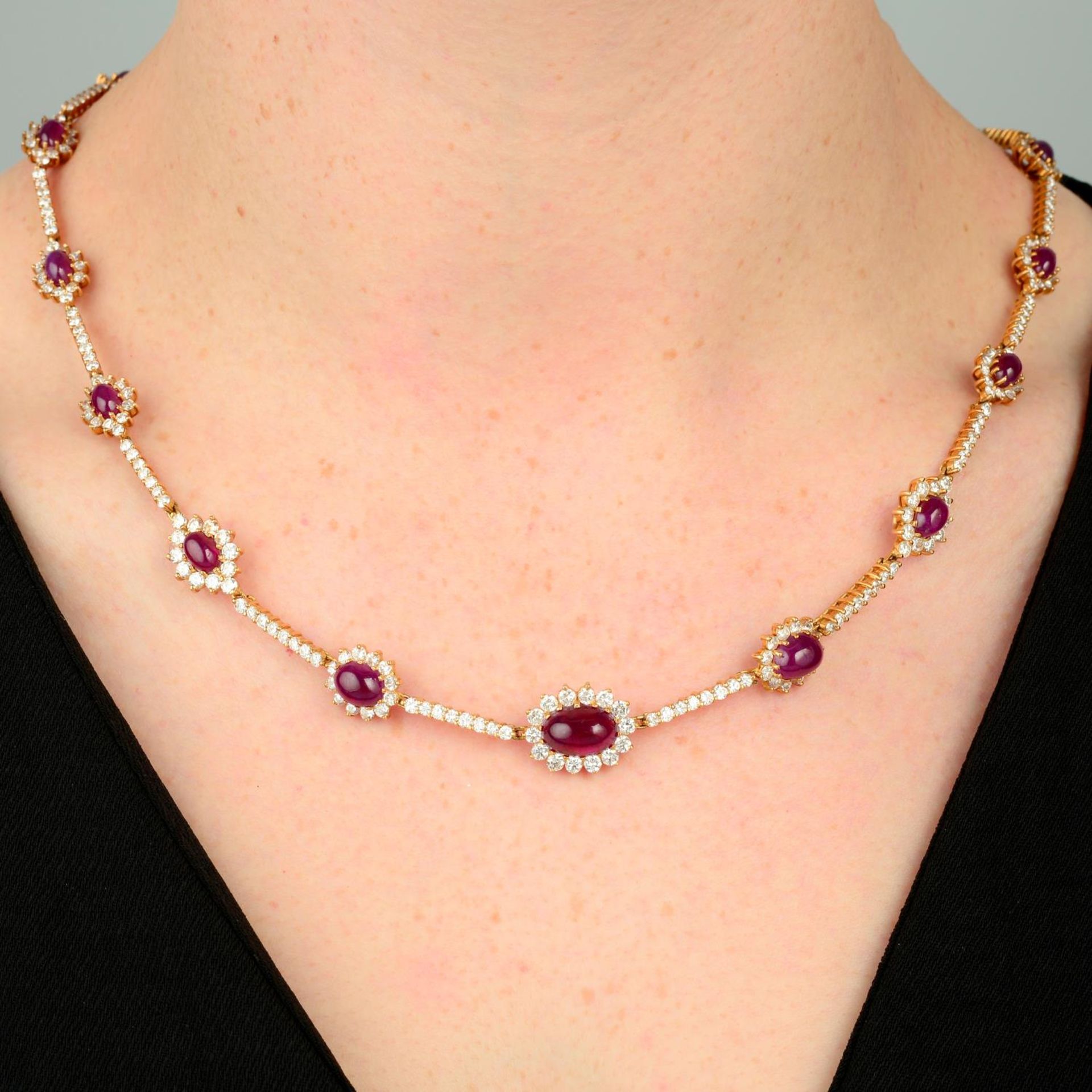 A Burmese ruby cabochon and diamond cluster necklace.