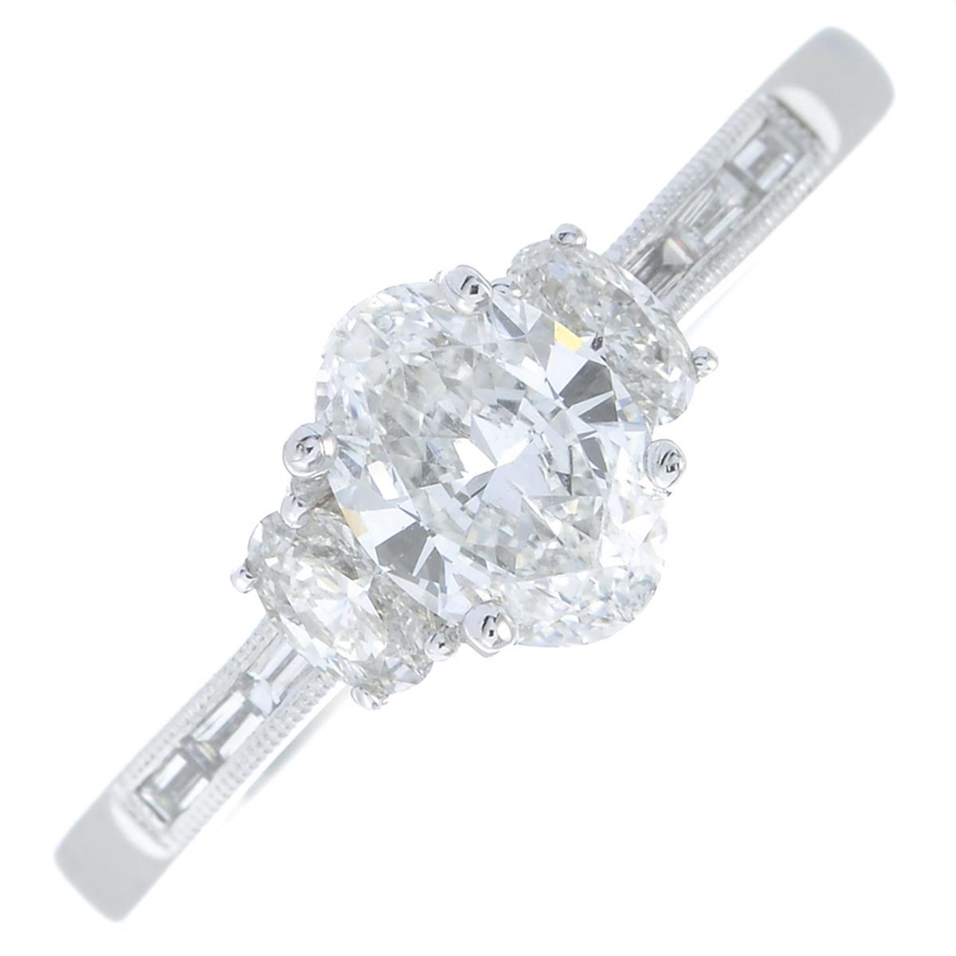 An oval-shape diamond single-stone ring, with oval-shape and baguette-cut diamond sides. - Bild 2 aus 6