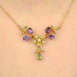 An Edwardian 15ct gold amethyst, peridot, seed and split pearl floral necklace.Stamped 15ct.