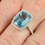 An 18ct gold aquamarine and brilliant-cut diamond dress ring.Aquamarine weight 3.90cts.Total