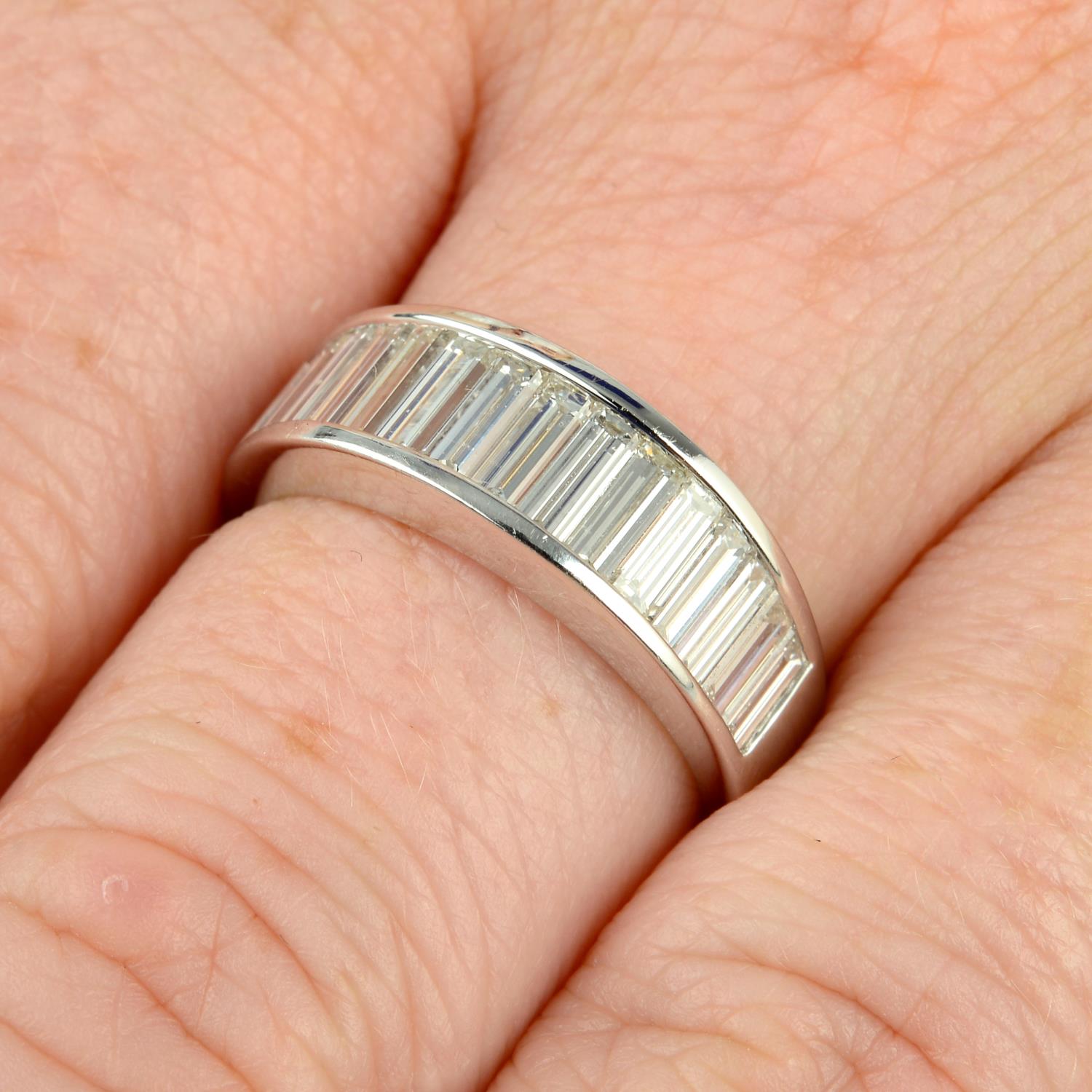 A graduated baguette-cut diamond half eternity ring.