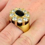 An 18ct gold sapphire and brilliant-cut diamond cluster ring, with onyx panel gallery.