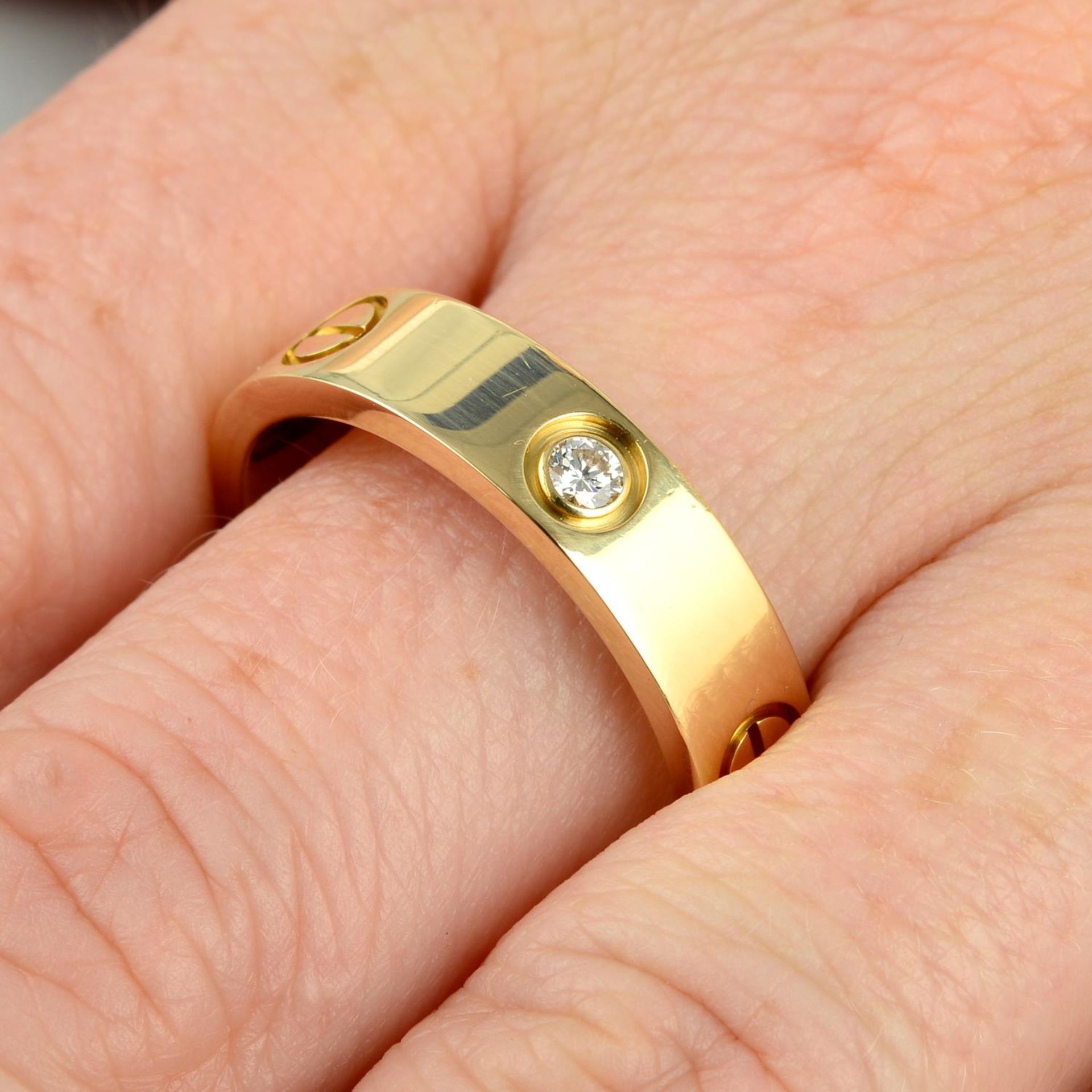 An 18ct gold diamond 'Love' ring,