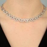 A diamond, scroll motif necklace.Estimated total diamond weight 3.50cts,