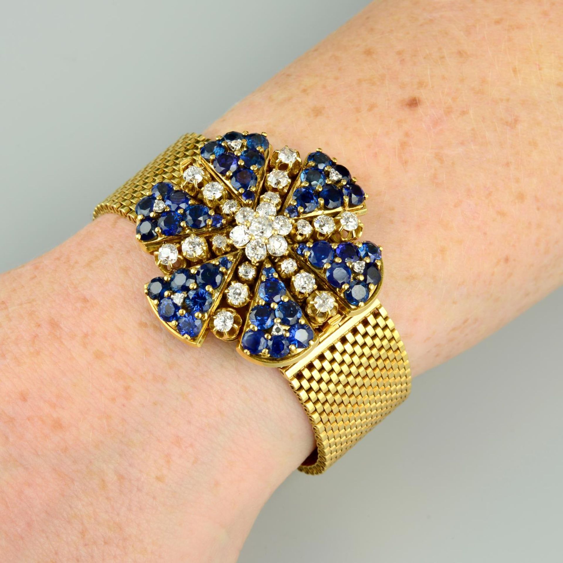 A mid 20th century old-cut diamond and sapphire floral bracelet.Central cluster detachable,